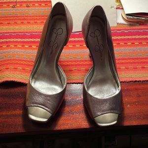 A pair Jessica Simpson stilettos.  Size 6.5. Silver or pewter in color.